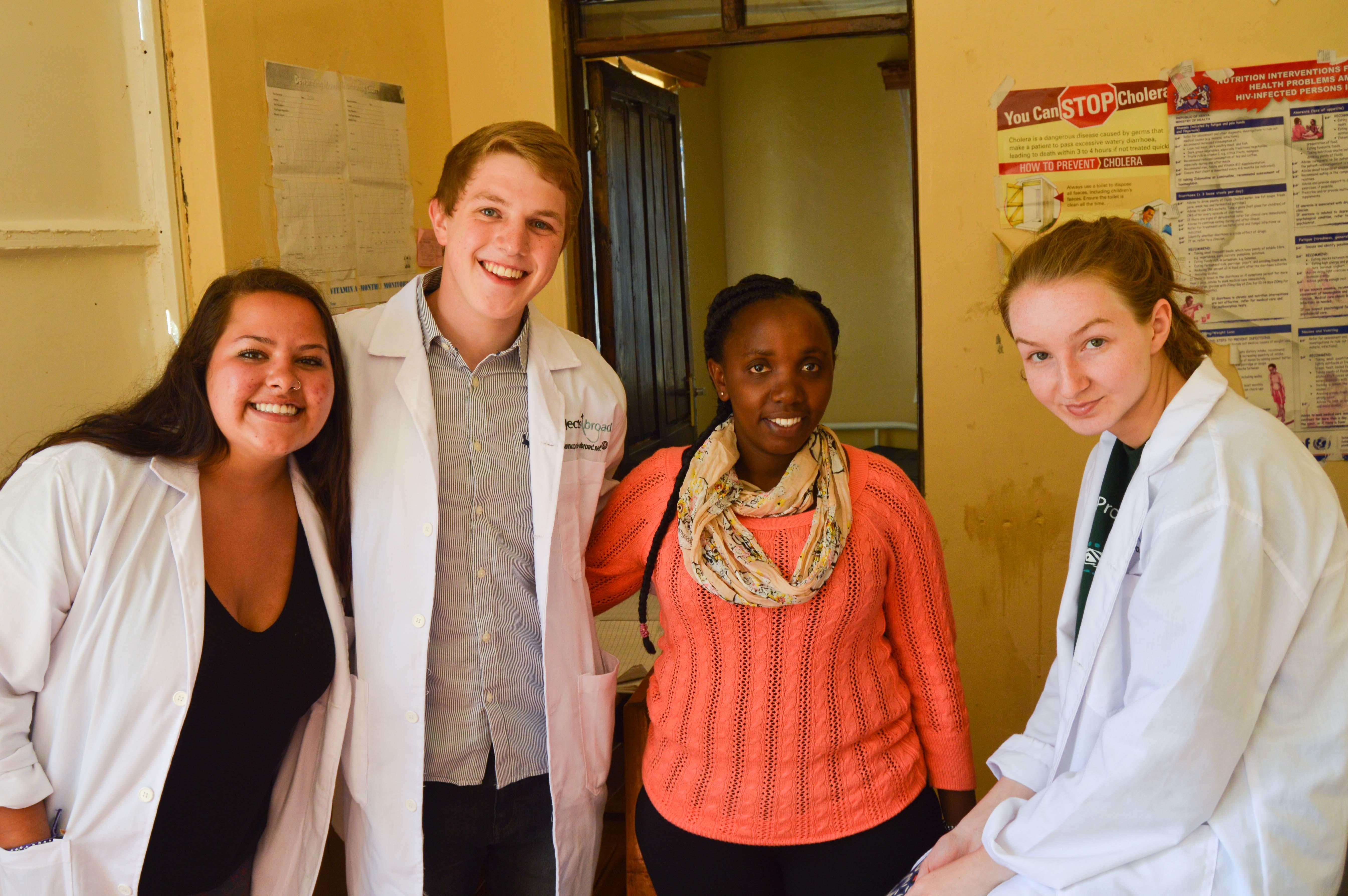 Medical interns from Projects Abroad with local nurses at a dispensary pictured during their occupational therapy internship in Kenya. Medical interns from Projects Abroad can be seen posing with local nurses during their occupational therapy internship in Kenya.